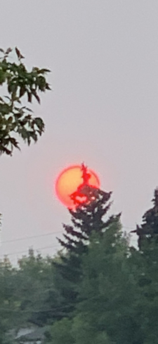 Flaming harvest moon Calgary, Alberta, CA