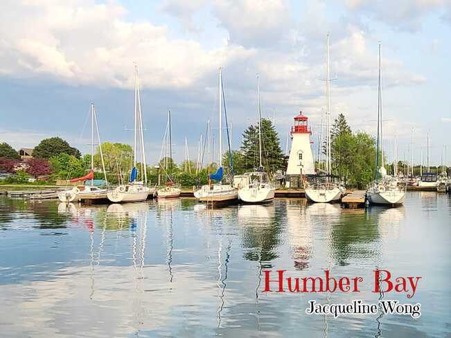 Humber Bay's tranquil scene with blue sky & water reflections/By Jacqueline Wong Toronto, ON