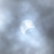 Eclipse through the Clouds