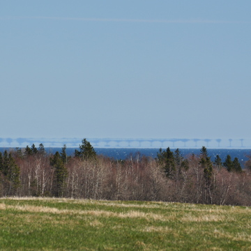 Confederation bridge viewed from Grande Digue, NB 63 km away 1 of 2
