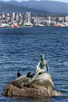 Statue near the shore of Stanley Park in Vancouver - roost for cormorants